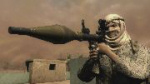 A man is holding a bazooka in his shoulder and seems to be about to fire it. It's a screenshot from a video game Soldier of Fortune.